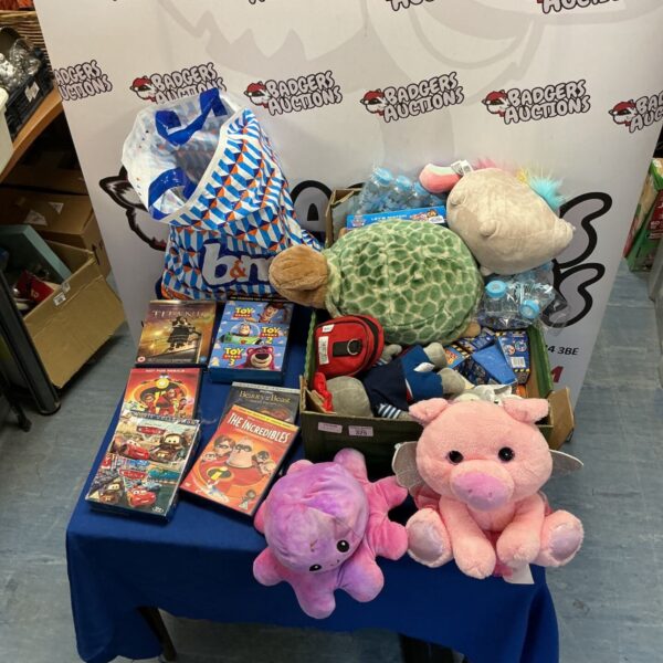 Disney DVD and toy lot featuring Toy Story, Cars, and Incredibles.
