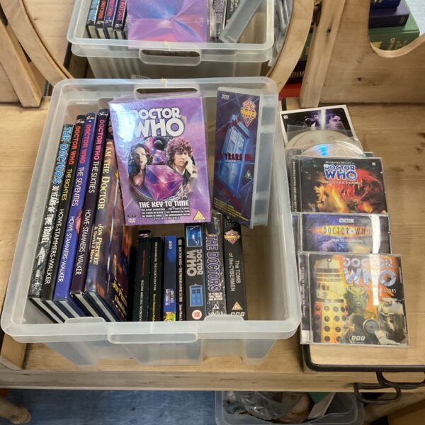 Doctor Who books, VHS tapes, DVDs and CDs in plastic storage boxes