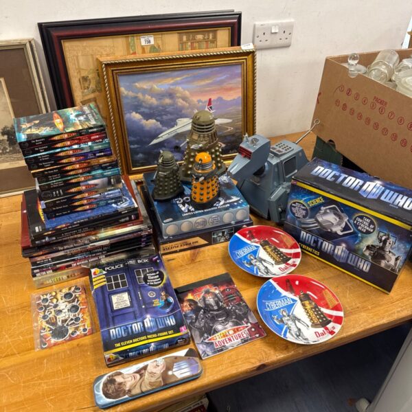 Doctor Who collectibles lot including books and puzzles.