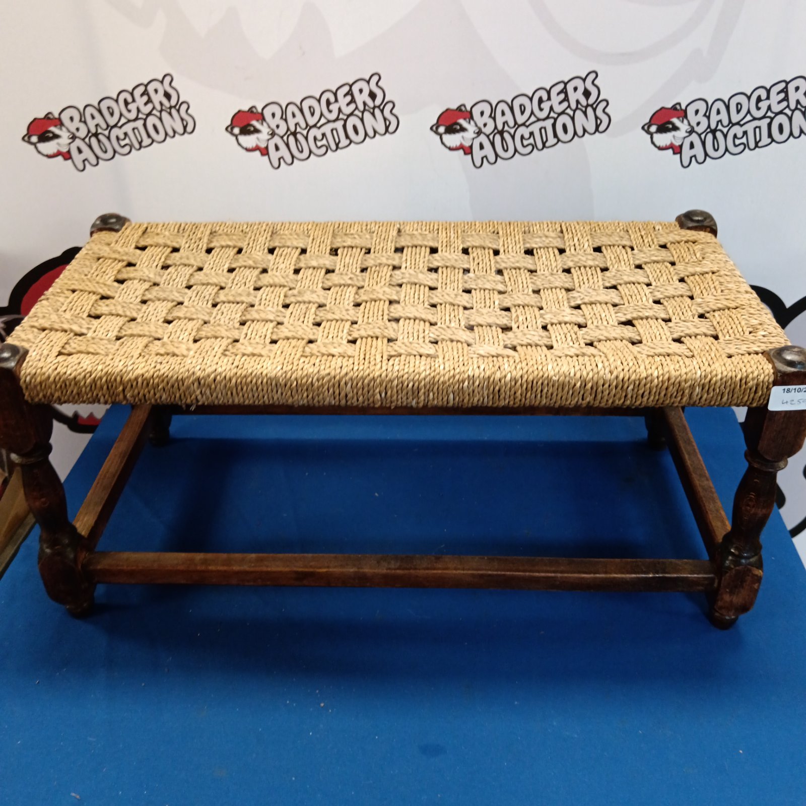 Vintage double footstool with oak frame and woven rush seat.