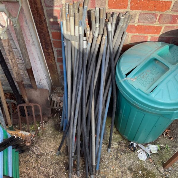 Large lot of used drainage rods for clearing blocked drains.