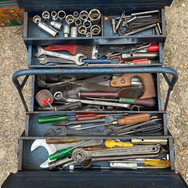 Open Draper cantilever toolbox filled with vintage tools.