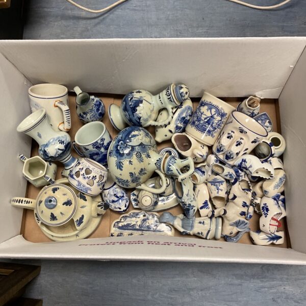 Box of assorted Dutch Delft blue china including clogs, mugs and jugs