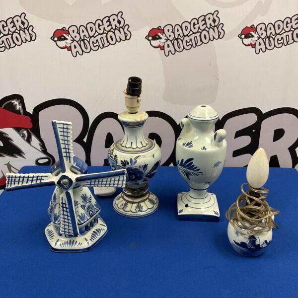 Four Dutch Delft blue table lamp bases including windmill and floral designs