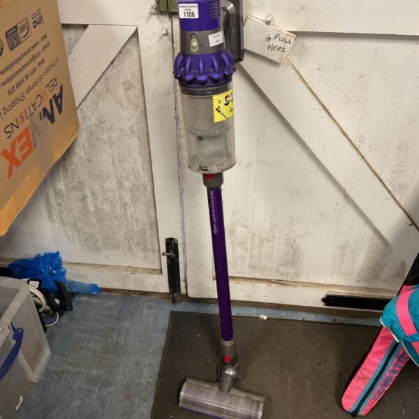 Dyson Cyclone V10 Animal stick vacuum cleaner in purple and grey with clear dust bin