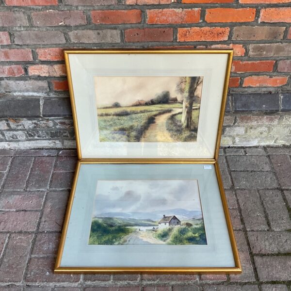 Pair of gilt-framed Edward Emerson Irish landscape watercolours on display