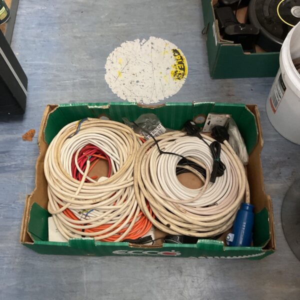 Box lot of coiled electric cable rolls and power cables in a green box