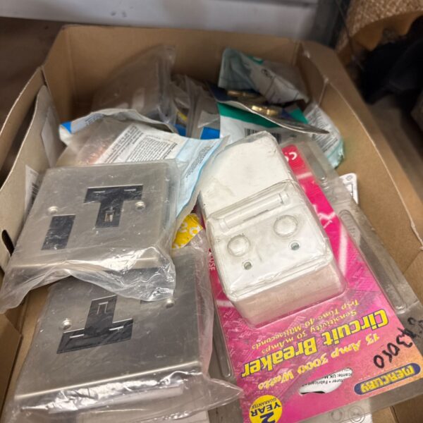Assorted vintage electrical switches and components in a tray.
