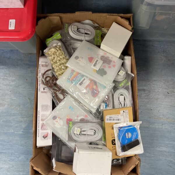 Mixed lot of electronic accessories including cables and gadgets.