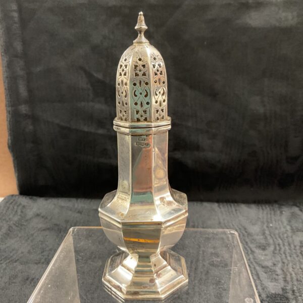 Hallmarked silver sifter by Emile Edward Viner with pierced domed top