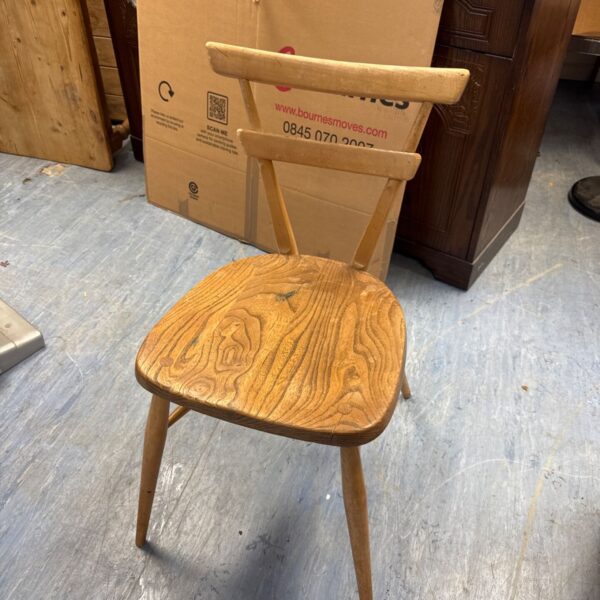 Vintage ercol stacking chair side view, mid century modern design.