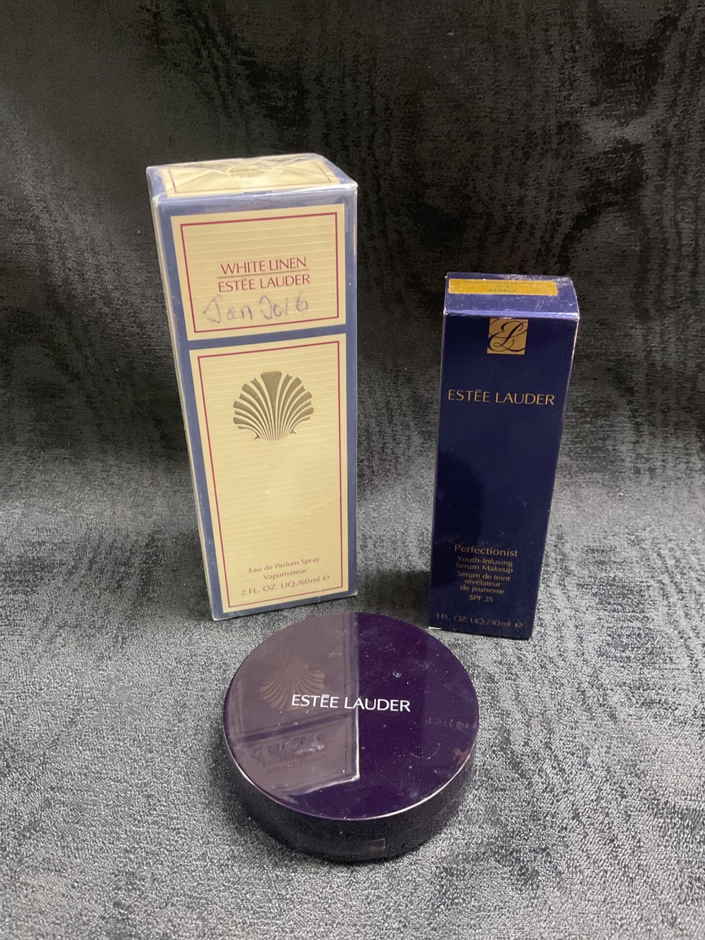 835 Three Estee lauder products White Linen perfume spray, perfectionist Serum makeup and Light medium powder compact