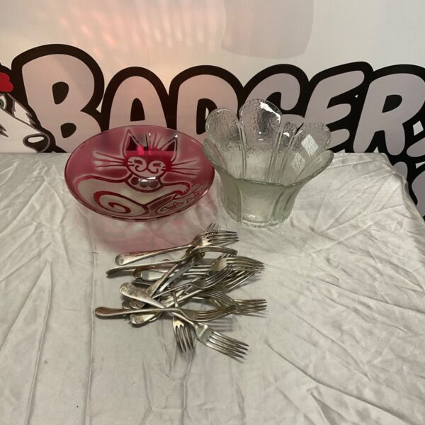 Pink etched glass cat bowl beside clear glass dish and silver plated forks