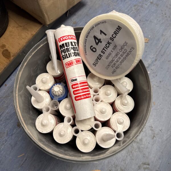 Evostik silicone sealant bucket with Super Stick scrim tape roll.