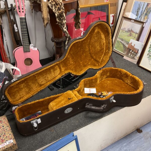 Open brown Faith guitar hard case with mustard plush interior lining