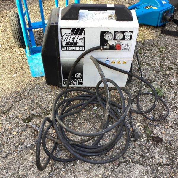 Fiac air compressor with coiled hose, ready for air tools.