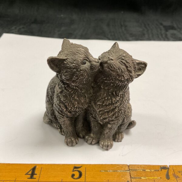 Filled silver figure of two seated kittens with textured fur detail