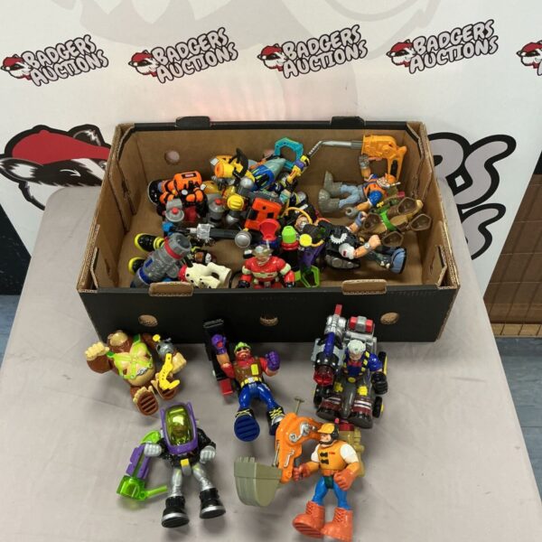 Vintage Fisher Price Action Hero figures in a toy lot.
