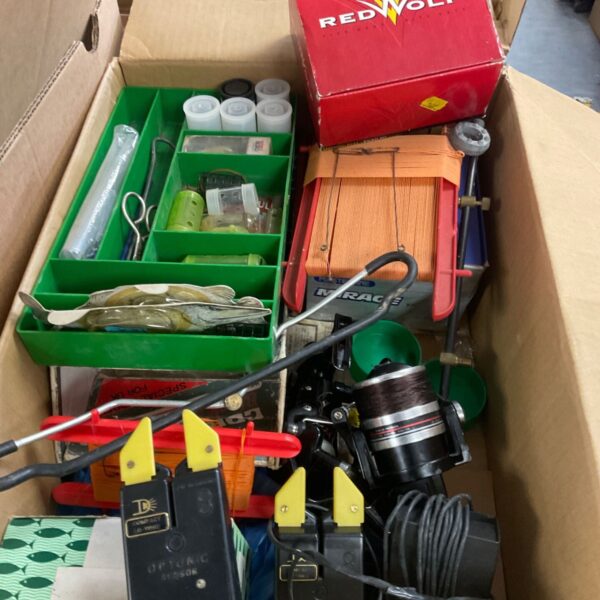 Box of fishing tackle with Optonic sensors, reels, lures and tackle box
