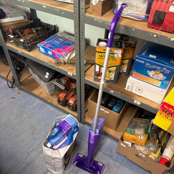 Flash Powermop with spare pads and detergent for floor cleaning.