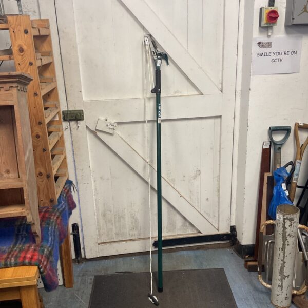 Used Flora tree lopper with extendable pole for garden pruning.