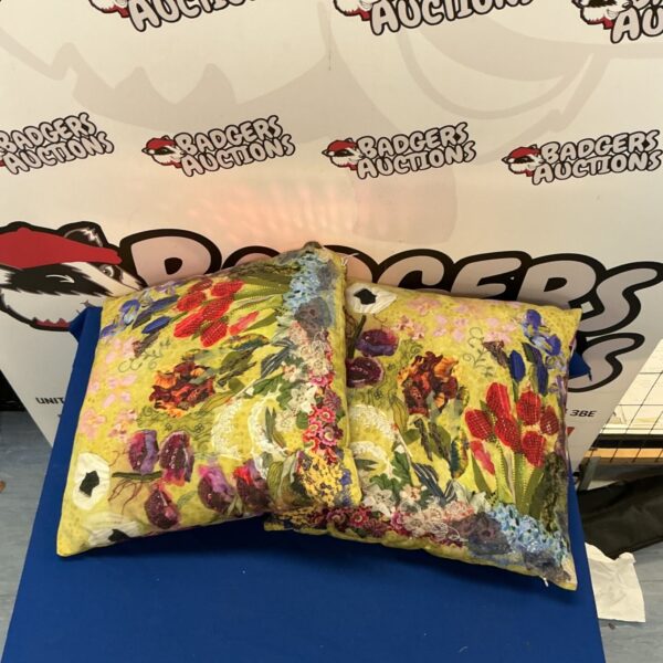 Vibrant floral cushions, a colourful patterned cushion pair.