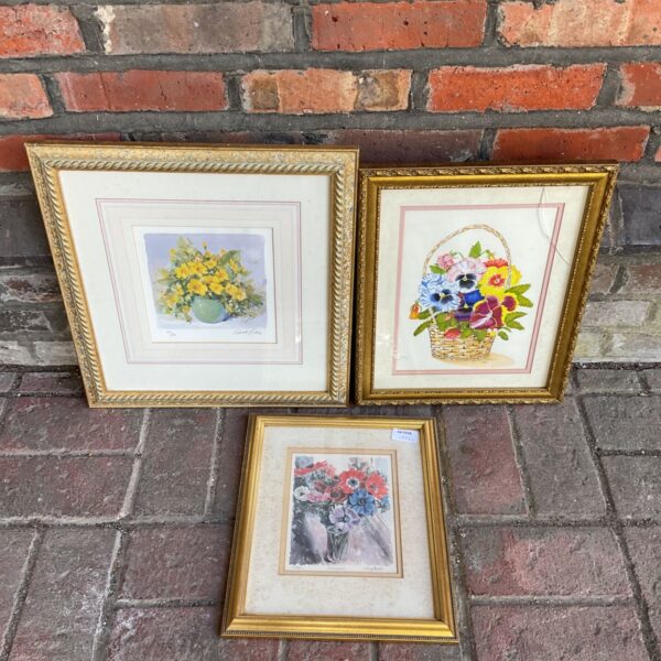 Two framed flower still life prints with vibrant colours.