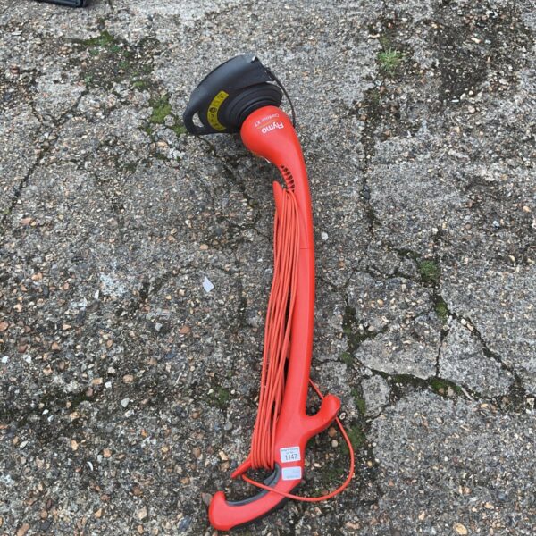 Red Flymo Contour XT electric strimmer for garden maintenance.