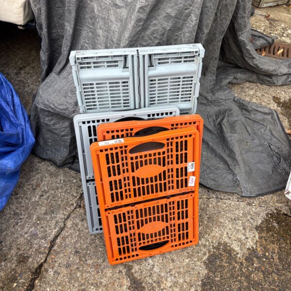 Lot of four grey and blue folding plastic storage boxes.