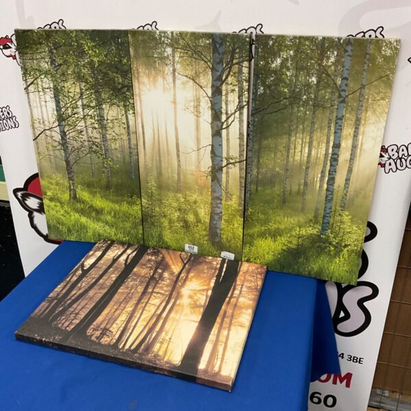 Four piece canvas wall art depicting a serene forest landscape.