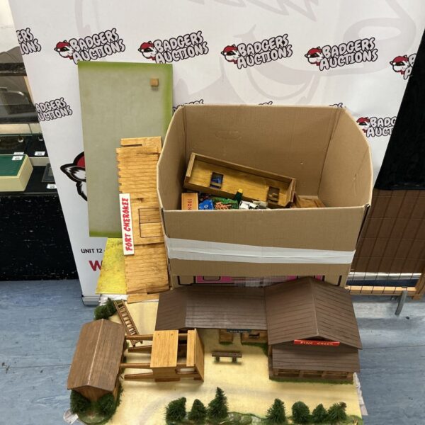 Fort Cherokee and Pine Creek wooden model sets with a box of vintage toys