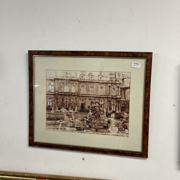Framed vintage photograph of a European fountain scene.