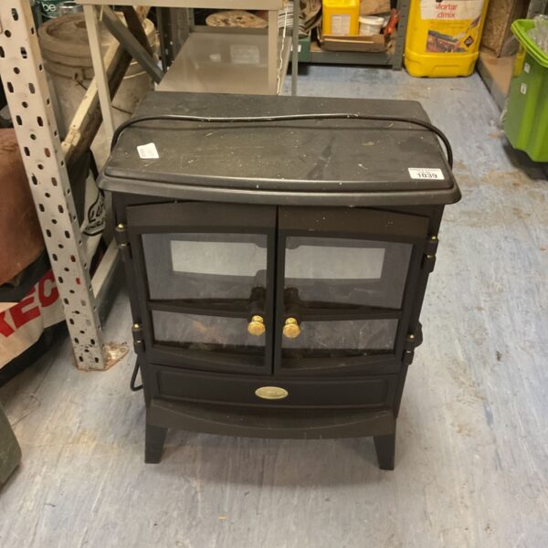 Black freestanding electric stove heater with glass doors and brass-coloured knobs
