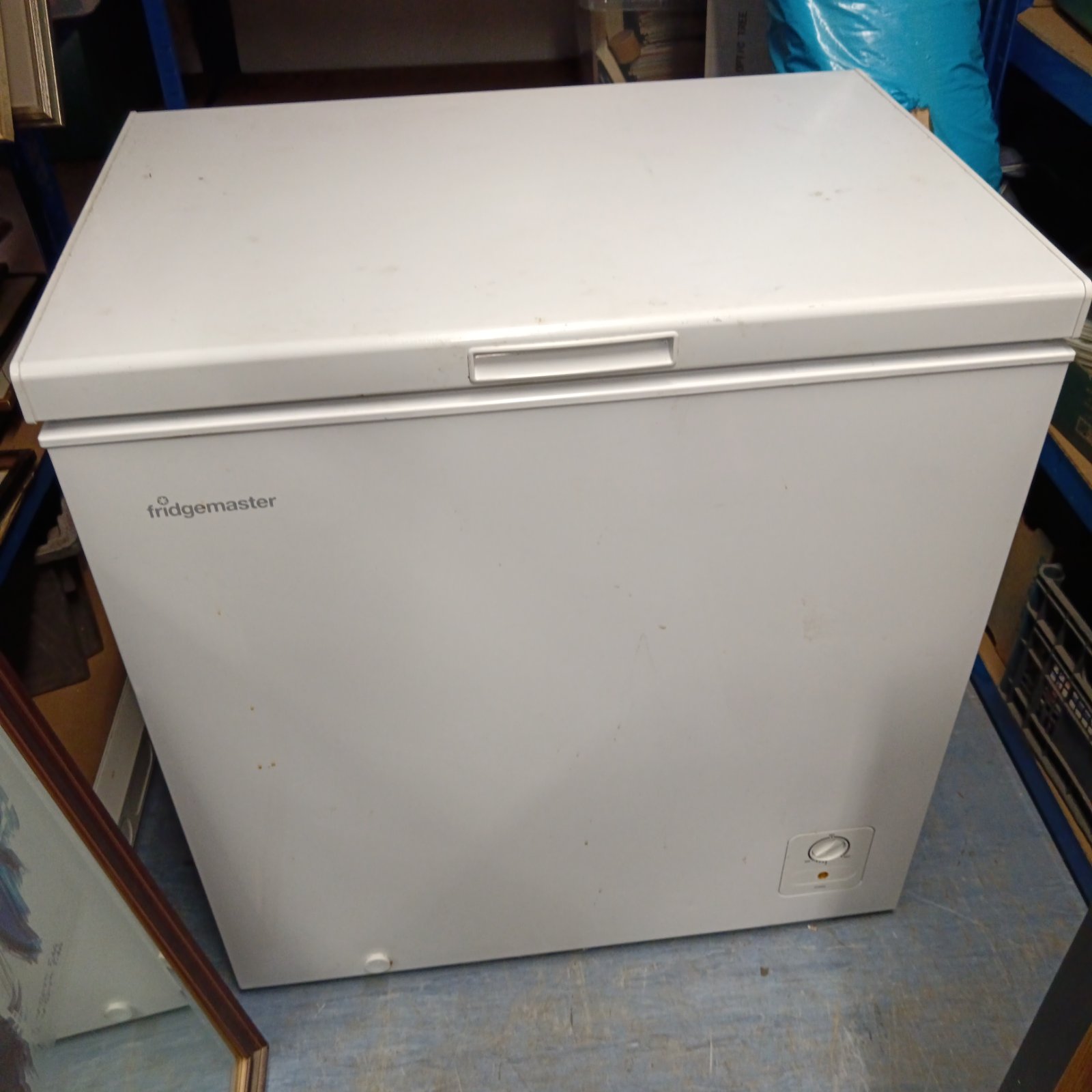 White Fridge Master chest freezer for frozen food storage.