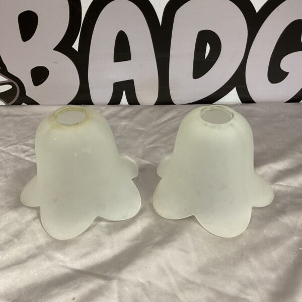 Pair of frosted glass bell-shaped lamp shades with scalloped edges