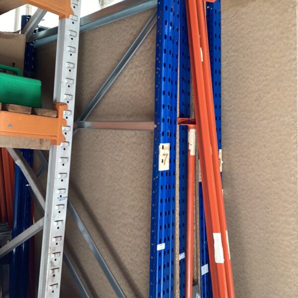 Blue and orange metal garage shelving bay section for storage.