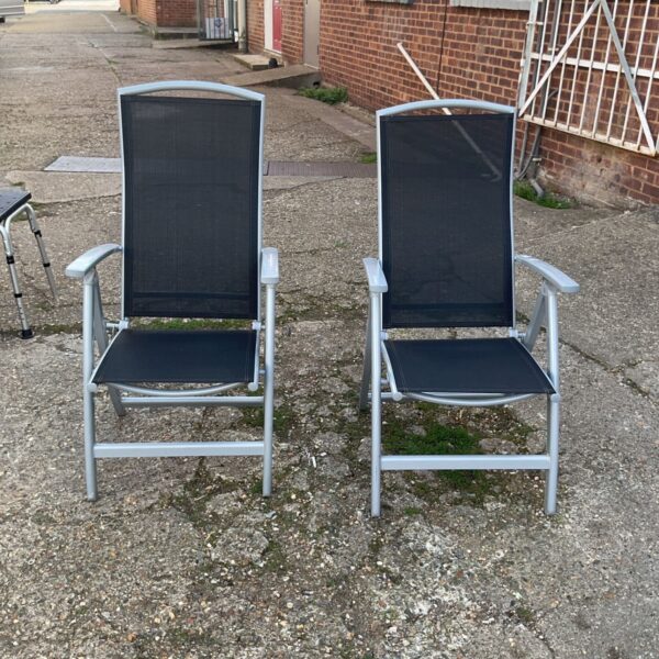 Pair of folding garden chairs with aluminium frames in a garden setting.