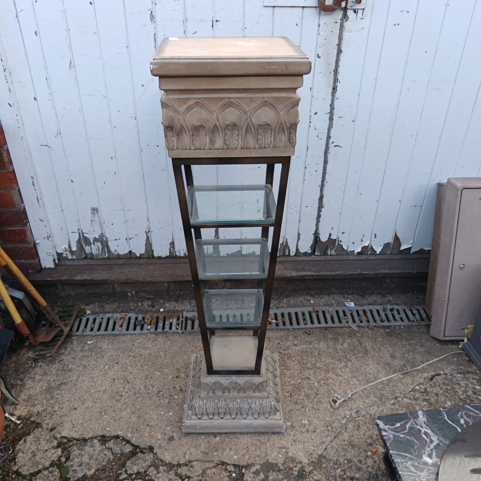 Five tier garden pot stand with stone effect tiers.