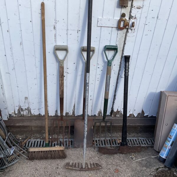 Vintage garden tool set including a matock and spade.