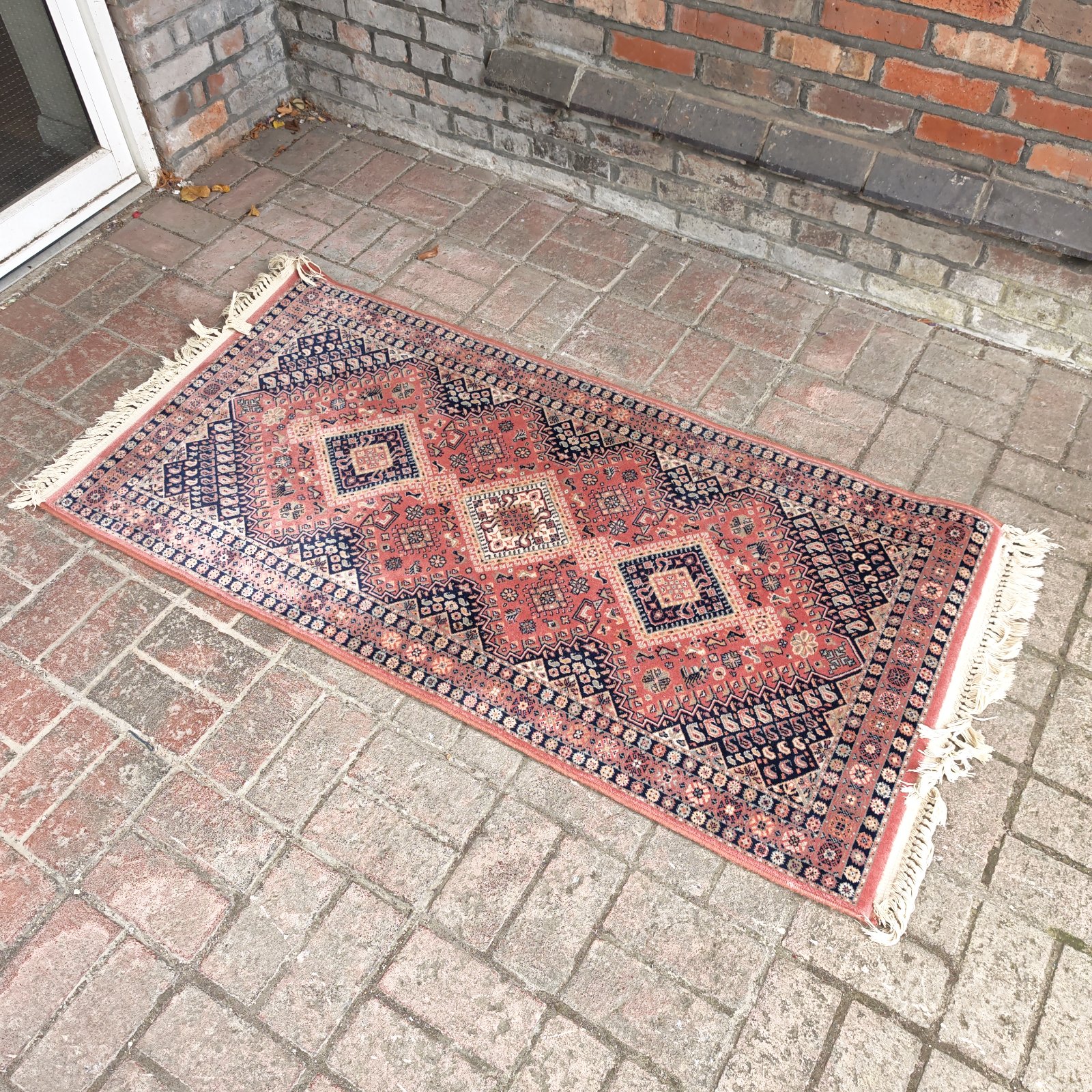 Vibrant geometric pattern on a vintage runner rug.