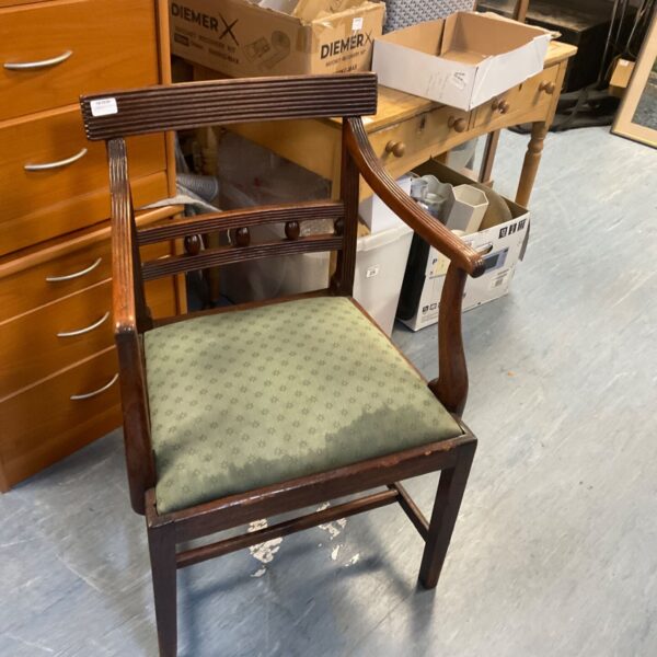 Antique George III mahogany armchair with upholstered seat and curved arms.