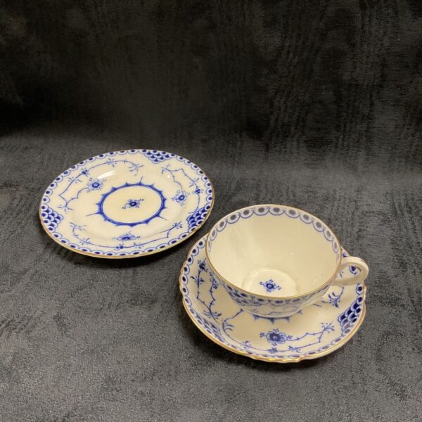 Antique George Jones Crescent China teacup and saucer with blue floral pattern.