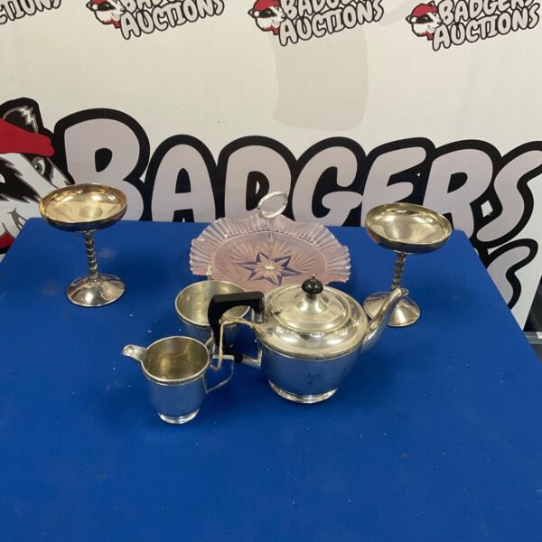 Georgian silverplate tea set with chalices and sandwich plate displayed.