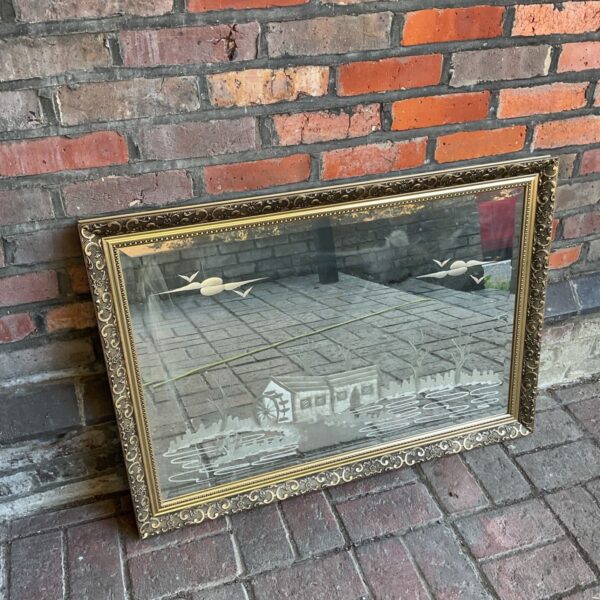 Antique gilt framed bevel edge overmantle mirror with etched water mill.