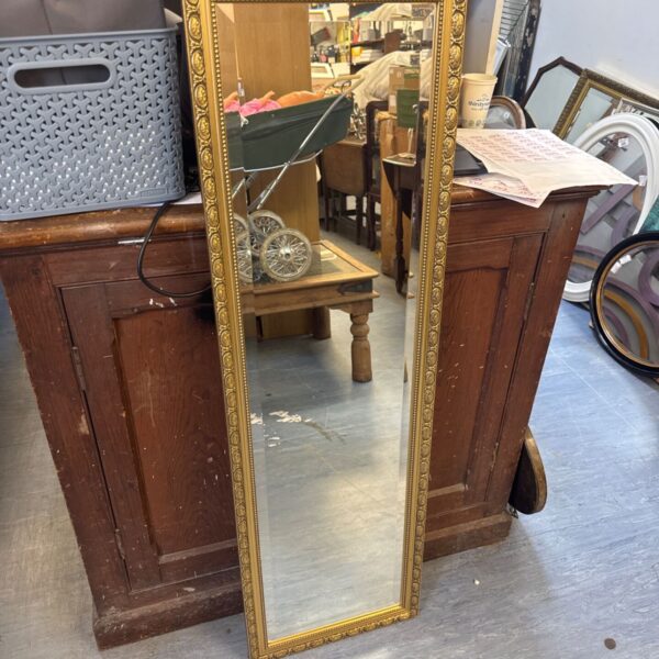 Ornate gilt framed bevel glass dressing mirror, antique style.