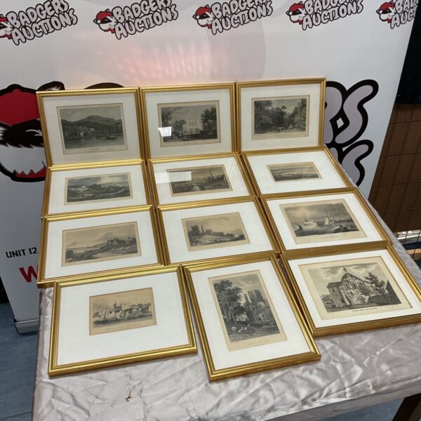Twelve gilt framed engravings arranged in rows on a draped table
