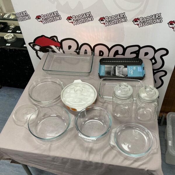Clear glass kitchenware set including bowls and trays.