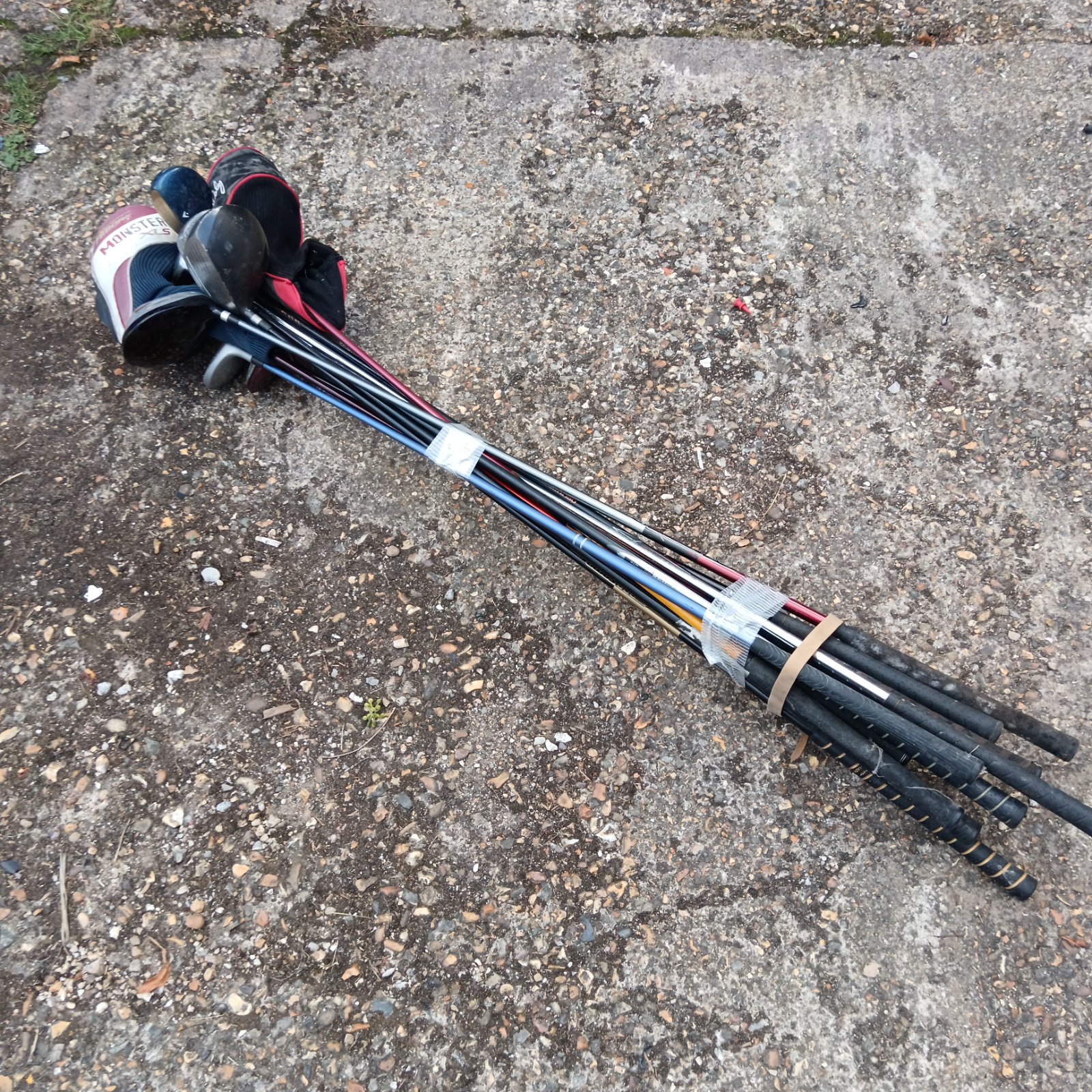 Bundle of used golf clubs, drivers and hybrids for sale.