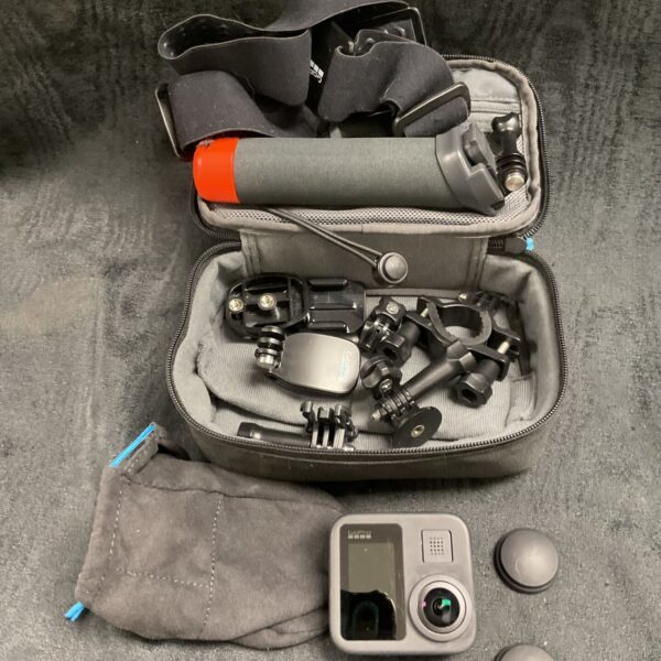 GoPro camera set with accessories in a protective case.