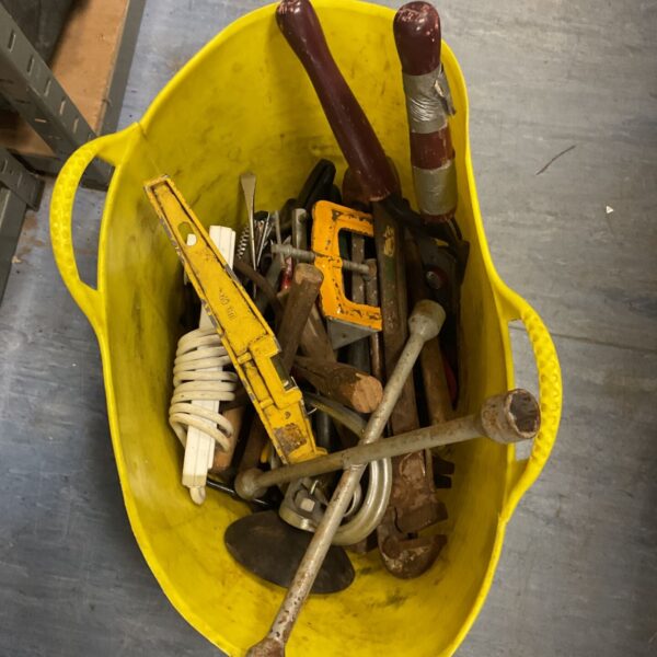 Yellow Gorilla Tub filled with a jumble of hand tools and lug wrenches